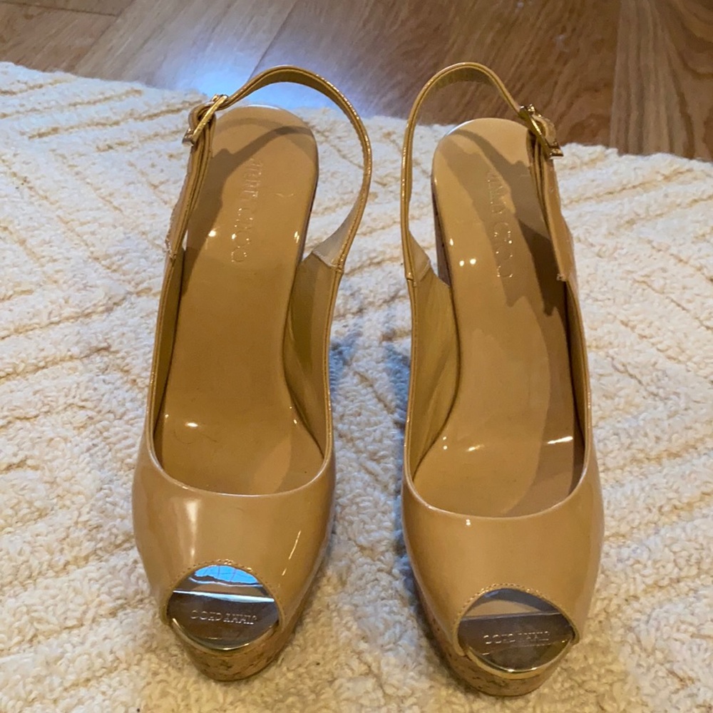 Jimmy Choo sling back wedge shoe. 100 percent leather and 5 inch heel